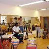 Madou Dembele prepares for drum class. Iowa City.